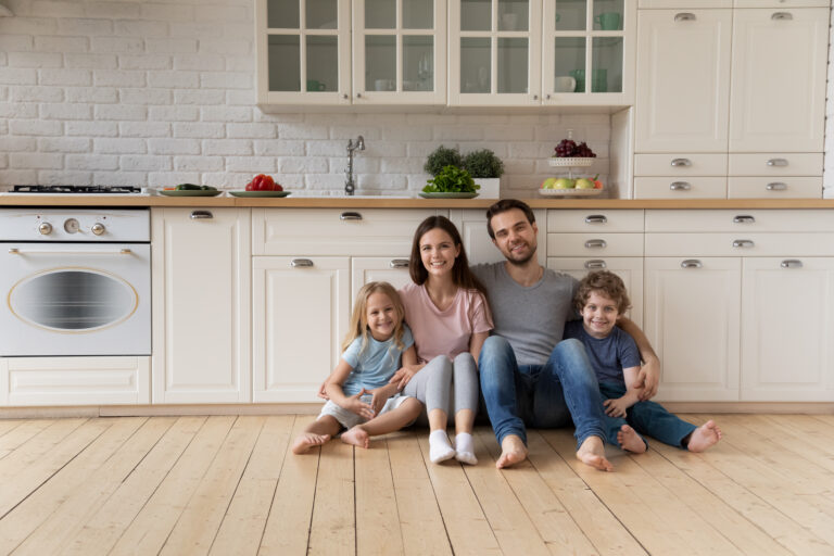 Family sitting on kitchen floor