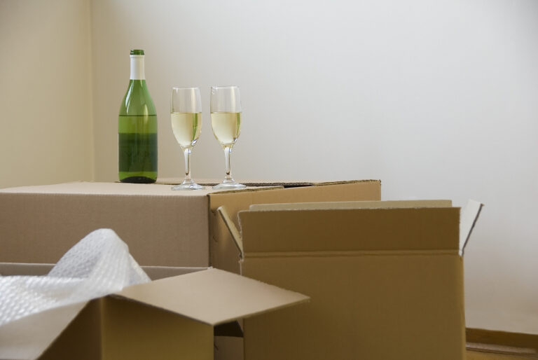 Two wine glasses on a moving box