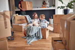 Couple unpacking/moving with children