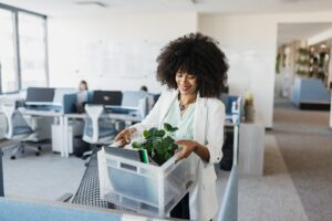 woman in melbourne FL begins to pack up her office